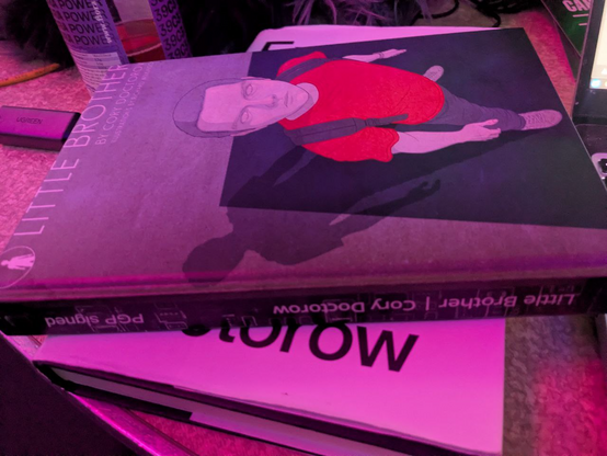 A printed copy of Little Brother noted "PGP signed"